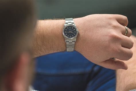 34mm watch on wrist|34mm watch on man's wrist.